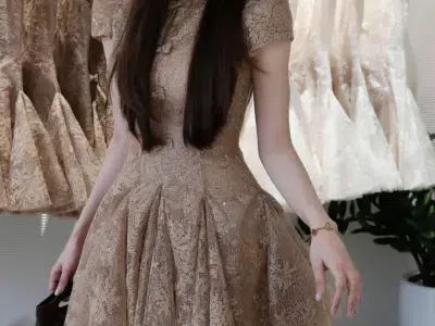Váy nhũ cổ tròn đính nơ dáng xoè